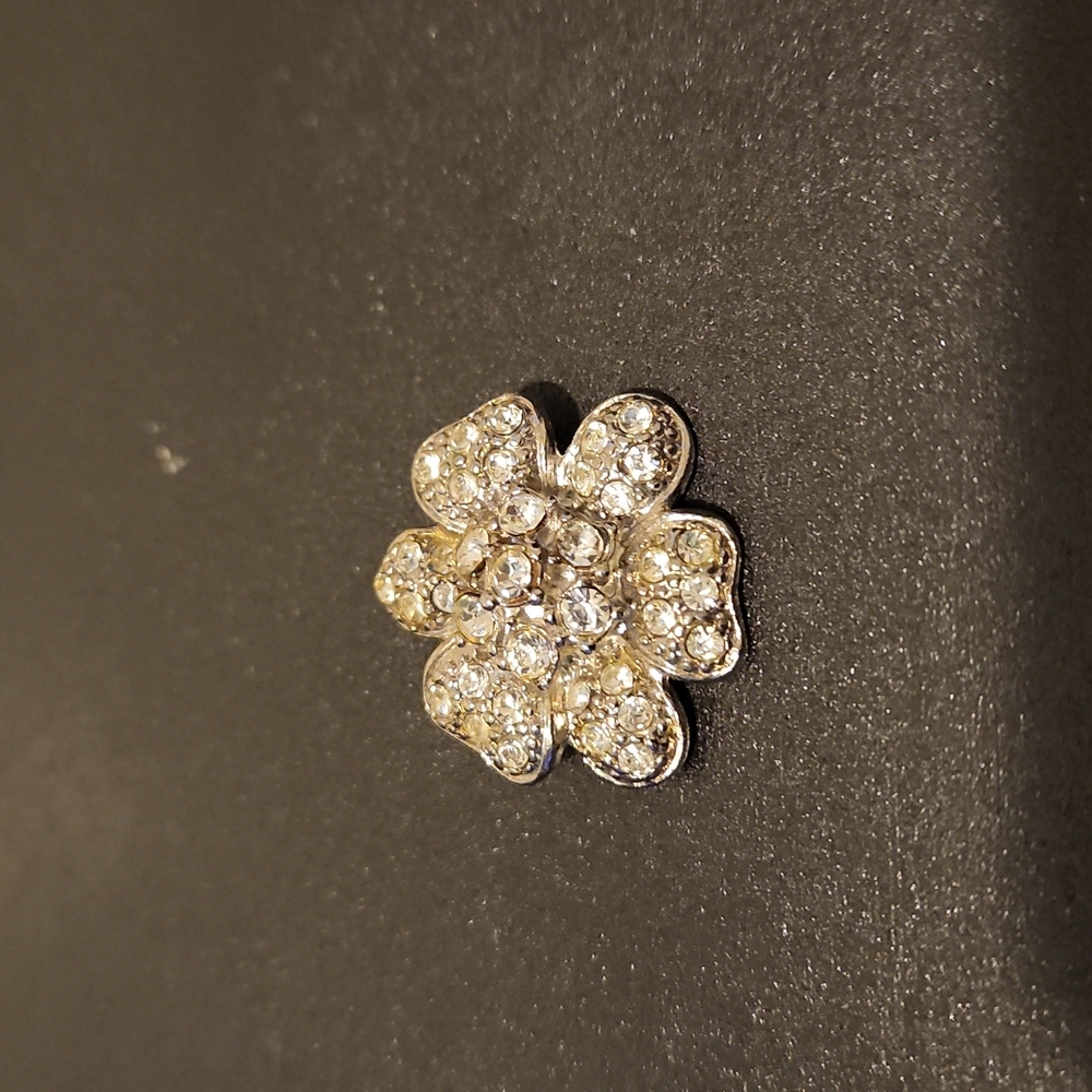 Silver flower brooch with stone inlay